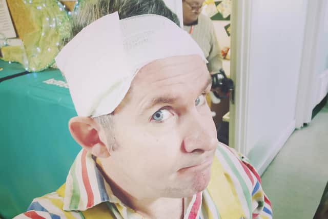 Adam Moss with his bandaged head.