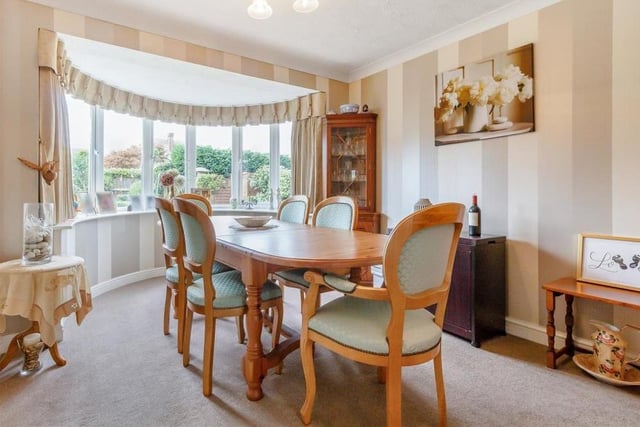The main feature of the dining room is its superb bay window that overlooks the back garden. It's not hard to imagine a splendid Christmas feast at this dinner table.