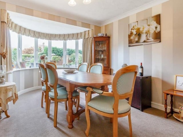 The main feature of the dining room is its superb bay window that overlooks the back garden. It's not hard to imagine a splendid Christmas feast at this dinner table.