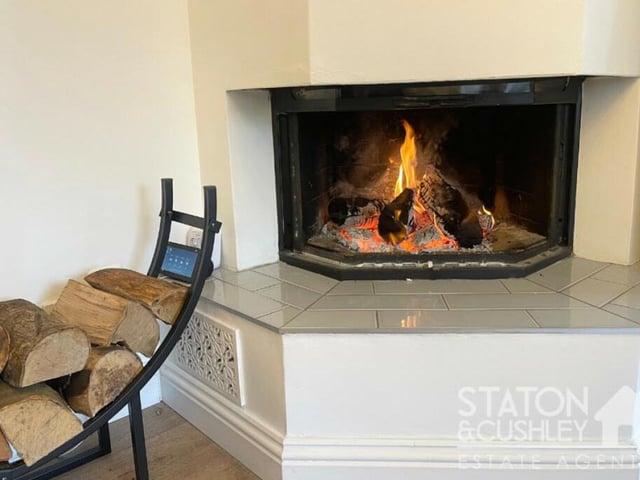A feature of the open-plan lounge/kitchen is this stylish multi-fuel burner, which gives the room a homely feel.