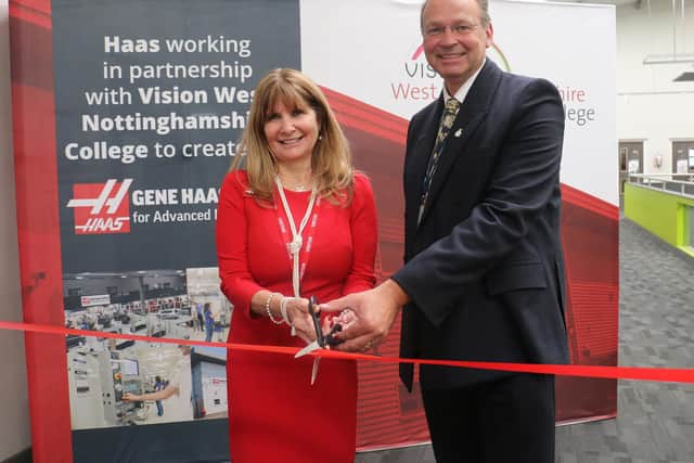 Kathy Looman, director of education at the Gene Haas Foundation, and Andrew Cropley, principal of West Nottinghamshire College, cut a ribbon to unveil the partnership between the two organisations.