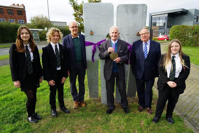 Artist Stephen Broadbent, volunteer Ken Wain, Cllr Tony King and pupils from Netherthorpe have attended the launch of the Markham Vale Mining Memorial.