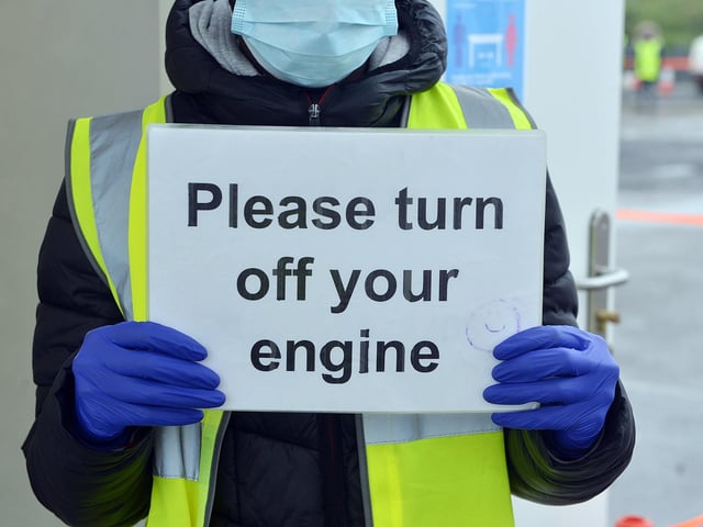 Visitors are asked to call a number listed on an A4 sign to receive instructions on how they will receive the test and what to do if they need help.
