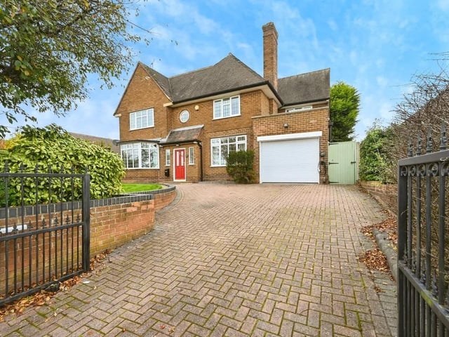 The property enjoys a block-paved driveway with gated access.