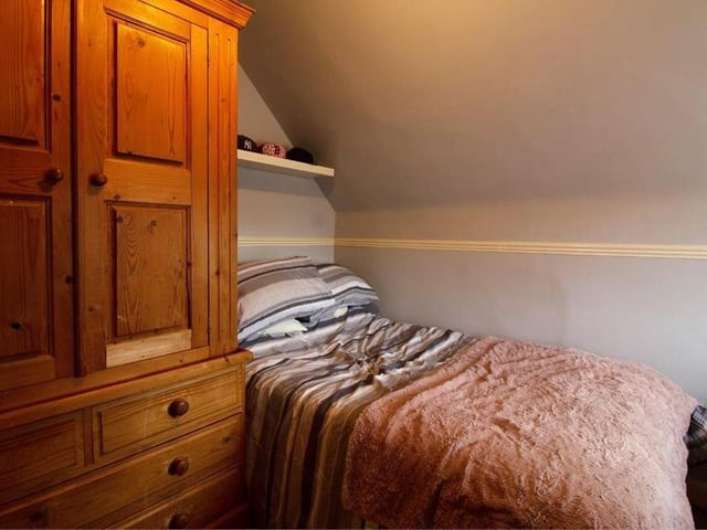 Moving further upstairs on to the second floor, and we find two more double bedrooms. This one has a fitted carpet, radiator and double-glazed window to the side of the house.