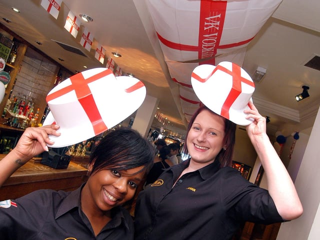 Staff members Denise Depass and Jenny Shaw pictured in the decorated pub ready for England's opening game of the 2010 World Cup.