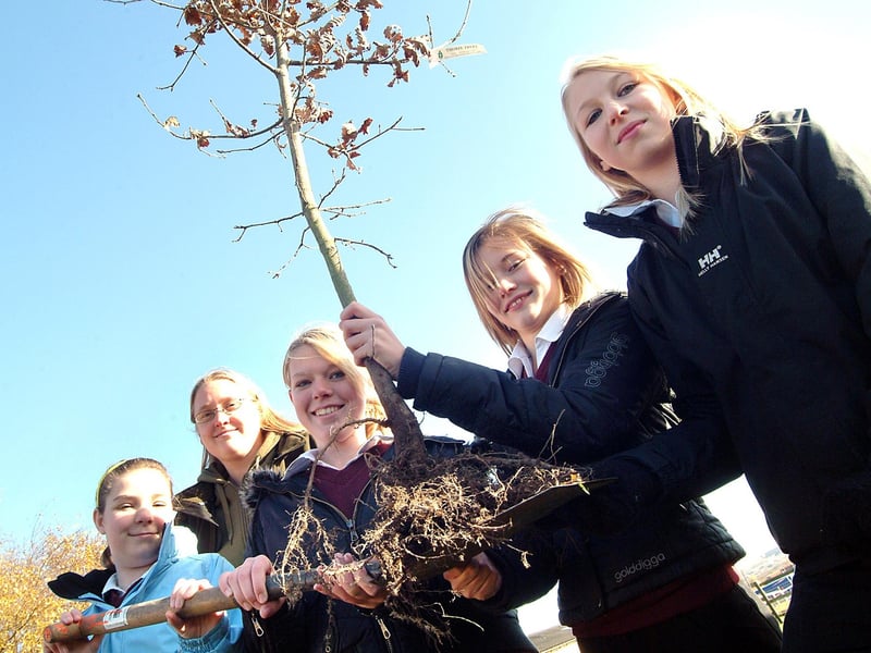 Year 8 Dukeries Centre pupils get their hands dirty when joining in with a tree planting session at the Ollerton college on Friday with community ranger Amy Chandler, second left, The girls from left, Bethany Chadburn, Melissa Hooks, Abby Matthews and Shanice Bend prepare to plant one of the 240 trees which included oak, birch, rowan and acer around the school grounds. 2007.