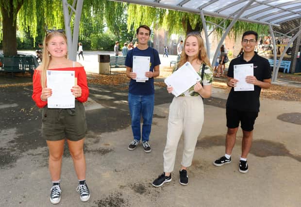 St Edmund's Catholic School students (l-r) Lydia Adie, Ross McGregor, Olivia Milne and Kazim Kanani all 16, collect their GCSE results. Picture: Sarah Standing (200820-3060)