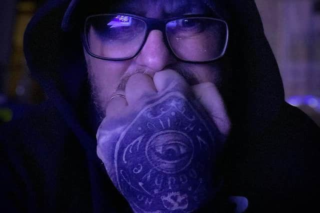 Ghost hunter Lee Roberts braves the cold on one of his investigations