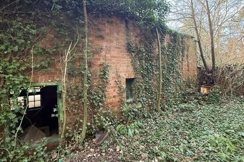 One of the outhouses on the two-acre site.