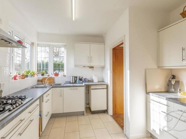 The kitchen comes complete with a range of modern units and cabinets, with worktops and an inset sink and drainer with mixer tap. There is also a walk-in pantry.