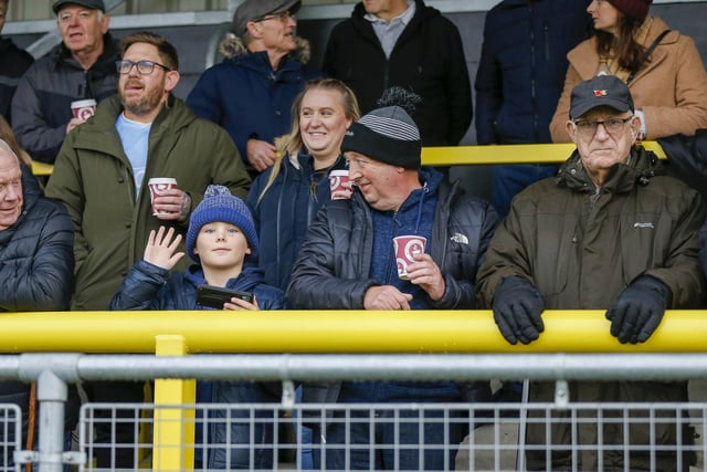 Mansfield fans at The EnviroVent Stadium for the match against Harrogate Town.