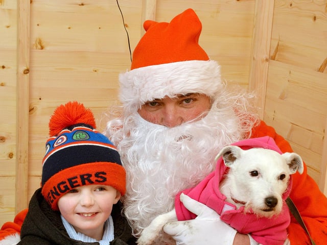 Santa Paws Dog Grotto at Mansfield Market in aid of Guide Dogs for the Blind Association, Santa meets Benjamin Wilkinson, four with rescue dog Daisy