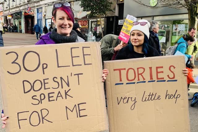Residents brought along placards and signs.
