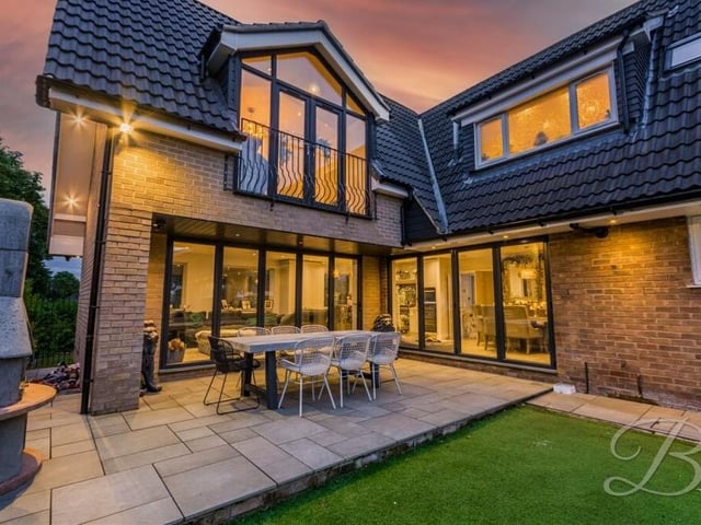 Let's step outside now to check out this view of the rear of the £675,000 Mansfield property. You can see the bi-folding doors on the ground floor and the bedroom balcony on the first floor.