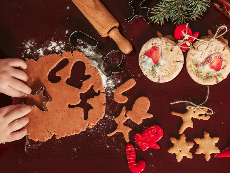 Salt Dough Ornaments: These are a simple, inexpensive and fun way to create a unique keepsake that can last for years. They require just flour (two cups), salt (one cup), and water (one cup). In a large bowl, combine the flour and salt. Gradually add the warm water, mixing until the dough starts to come together. Turn the dough onto a lightly floured surface and knead for 5-10 minutes until it is smooth and easy to handle. Roll the dough out to about 1/4-inch thickness on parchment paper. Use cookie cutters to cut out shapes and place them on a parchment-lined baking sheet, then create a hole with a straw at the top for hanging (not too close to the edge). Finally bake in a low-temperature oven (around 250°F or 120°C) for 1 to 3 hours, or until completely dry and hard to the touch, and paint!