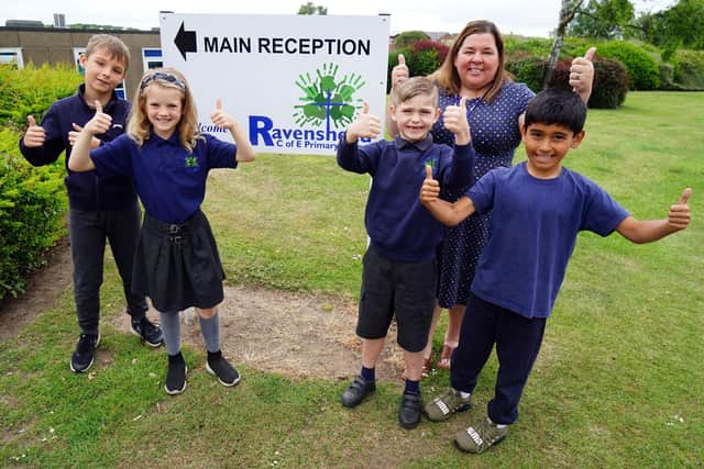 Emma Johnson, Ravenshead CE Primary headteacher, celebrates its good Ofsted report with pupils Jake Foley, Ava Bytheway, Alfie Nurse and Harvey Evans.