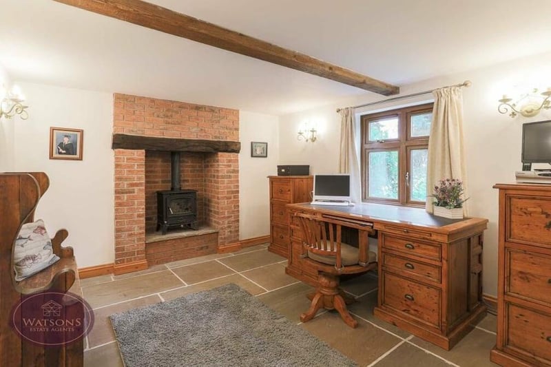 The attractive study at The Three Horseshoes boasts another of the period property's feature fireplaces. It is brick-built with an inset multi-fuel burner. Slate tiled flooring adds to the charm of the room.