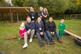 Hucknall MP Mark Spencer (centre) with Hucknall councillor Phil Rostance (left) and representatives of QTS and and staff and children from the nursery at the new forest garden