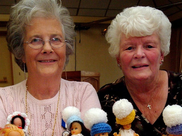 Kathleen Wilson and Betty Hackett, volunteers at King's Mill Hospital, with some of the crafts made by volunteers to raise funds. The crafts were on display at the annual tea party for volunteers which celebrated the work they do for the hospital. The tea party was at The Towers pub in Botany Avenue. 2007.