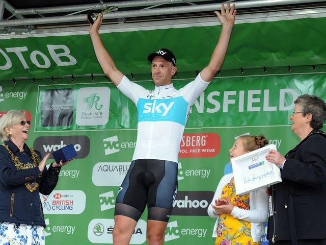 Winner Ian Stannard takes to the podium to receive his awards from Mansfield Mayor Kate Allsop and the chairman of Nottinghamshire County Council, Coun. Sue Saddington.