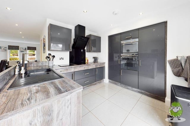 A closer look at the sparkling kitchen. Integrated appliances include an oven, fridge and hob.