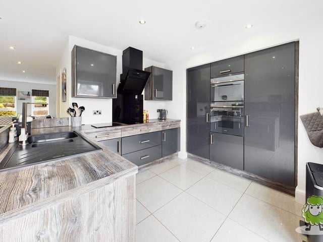 A closer look at the sparkling kitchen. Integrated appliances include an oven, fridge and hob.