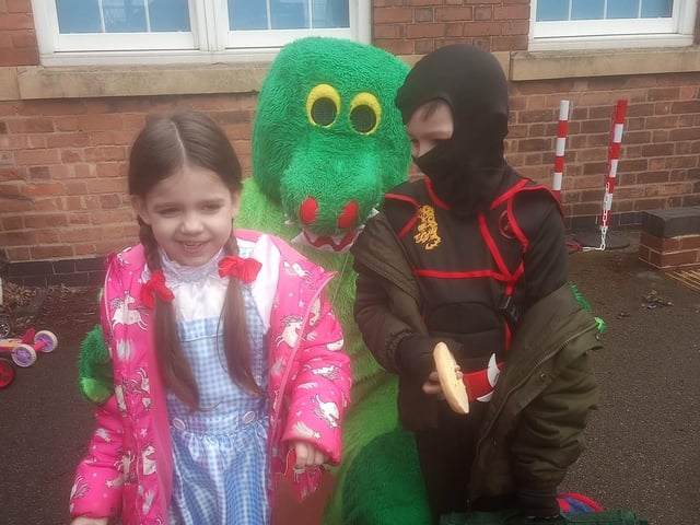 Shianne, age 7, dressed as Dorothy and Keegan, age 8, dressed as a ninja, both pictured with Croc from Peter Pan.