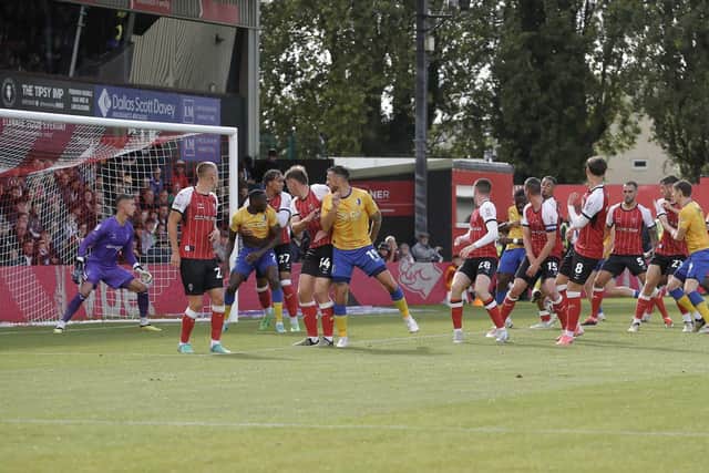 Mansfield Town defender Deji Oshilaja (23) scores a late consolation goal during the Sky Bet League 1 match against Lincoln City FC, LNER Stadium, 24 August 2024 Photo credit Chris & Jeanette Holloway / The Bigger Picture.media