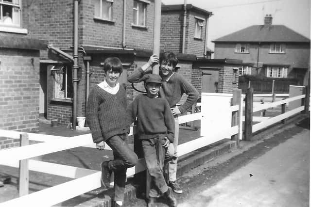 THEN - outside Brierley Cottages again in 1965 are Steve's pals, (from left) Dave Godson, Donald Day and Johnny Gaunt.