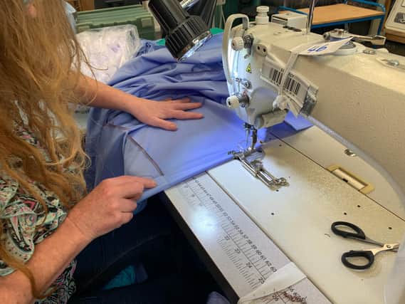 A reusable gown being made at Anze.