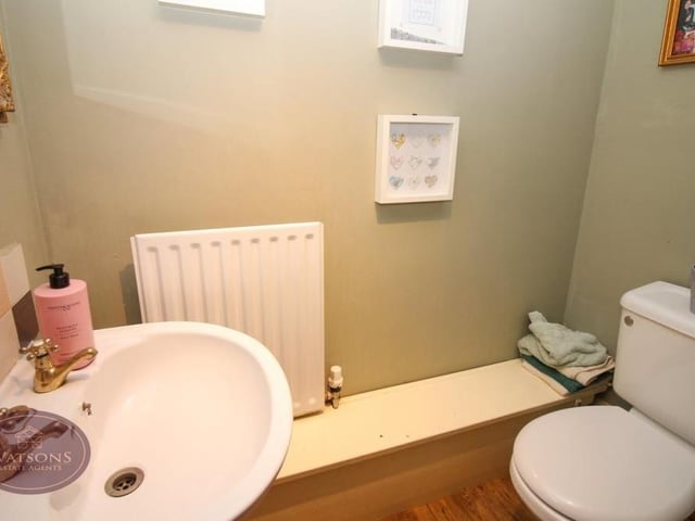 The downstairs toilet comprises a wash hand basin and WC.