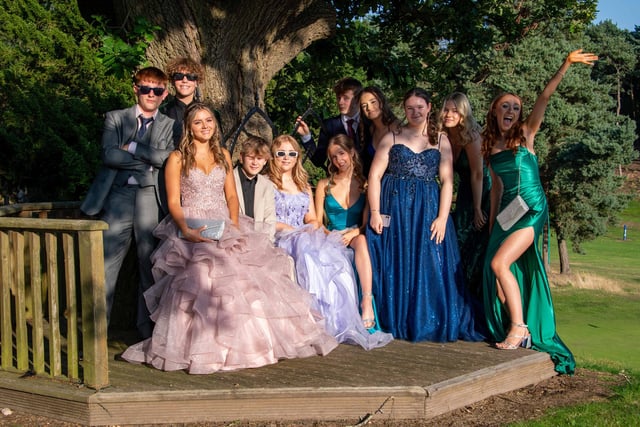 School friends celebrating the end of an era at their formal prom.