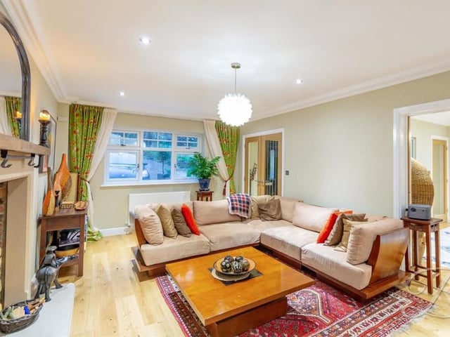 A second look at the living room, which offers true home comforts. It has downlights, coving to the ceiling and a window facing the front of the house.The dining room is to the right, via sliding doors.