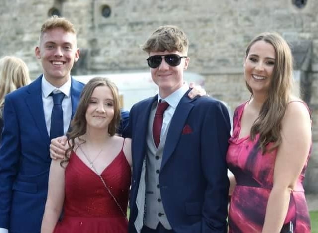Twins Thomas and Bobbie Wilson with their head of year 11 and long-term school friend at the prom.