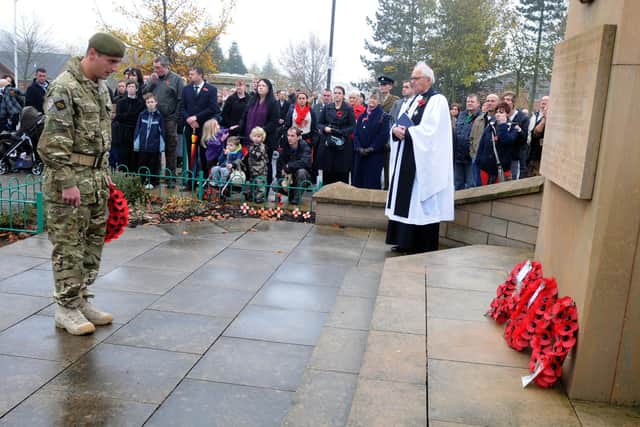 A solider lays a wreath at a former remembrance event in Mansfield.