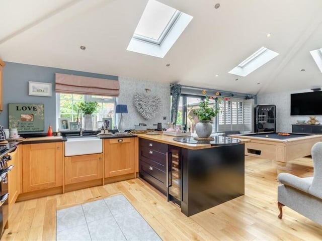 One of the highlights of the property is an extension that houses this open-plan kitchen/diner and living space, complete with a 3.5-metre high vaulted ceiling and four large Velux roof windows.