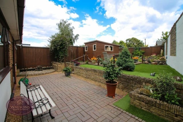 As we step outside the £375,000-plus Kimberley property, let's look around the beautiful garden. It includes a block-paved patio.