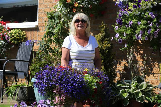 Peter Evans of Somersby Court in Mansfield is wanting to praise his neighbours for making their gardens look so wonderful. Pictured is Eireen Brooks with her garden.