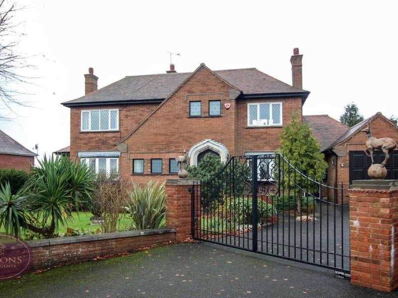 Returning to the front of the £425,000 property,  secure, electric gates open on to a substantial driveway, offering off-street parking space. The tarmacadam drive leads to an integral garage, which has power and a remote-controlled up-and-over door and also houses the property's boiler.