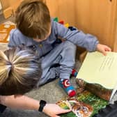 A typical example of a member of staff helping a young child to learn at Kidzgrove Daycare nursery in Mansfield Woodhouse, which has been given a rating of 'Good' by the education watchdog, Ofsted.