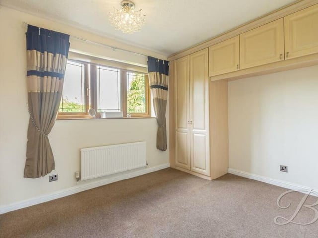 Over-bed storage, fitted wardrobes and a fitted carpet make the fourth and final bedroom at the Mansfield house another attractive proposition.