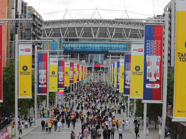 Mansfield Town fans soak up the Wembley atmosphere.