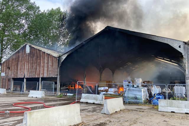 Thick black smoke bellows from the Elkesly structure