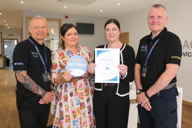 Just4Mortgages director Kerri Andrews (second right) receives a five-star customer service sticker and certificate from the college’s retail apprenticeship manager, Rebekah Thompson, Mansfield Forward BID chief executive Jay Rowlinson (left) and the BID outreach manager, Daryl McGreade. Photo: Submitted