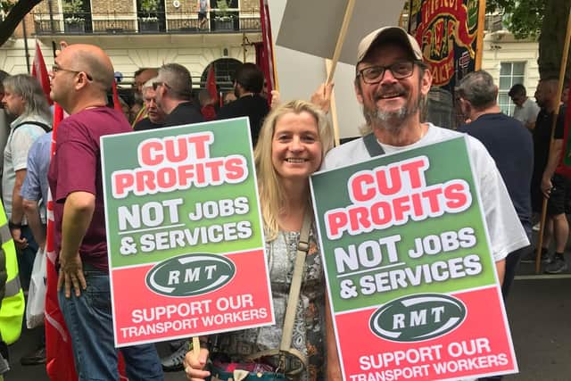 Andy Harkins, joined by wife, Helen, at the TUC demonstration in London.