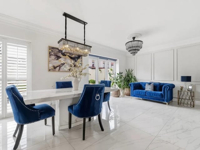 The dining area flows seamlessly from the kitchen and enjoys direct access onto the landscaped rear garden through bi-fold doors