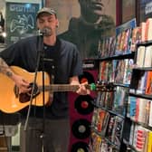 Reece Mee, known by his stage name - Reece Feel Over, performed original songs to a growing crowd of customers.