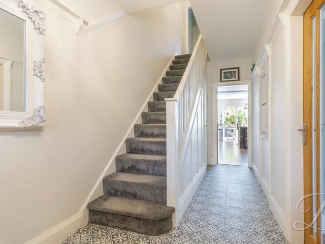 Are you ready to go up the carpeted staircase in the hallway to have a look at the four bedrooms?