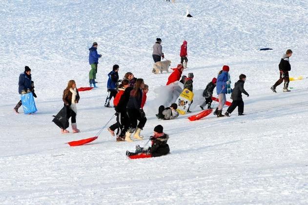 Kids and adults alike take to the slippery slopes at Fisher Lane in early January 2010.